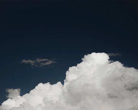 Big white cloud formation in a dark blue sky
