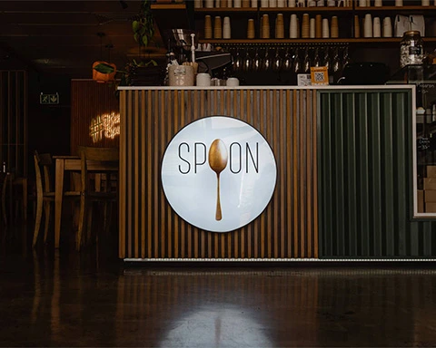 Spoon Bakery and Eatery interior from the front entrance with the logo against the counter