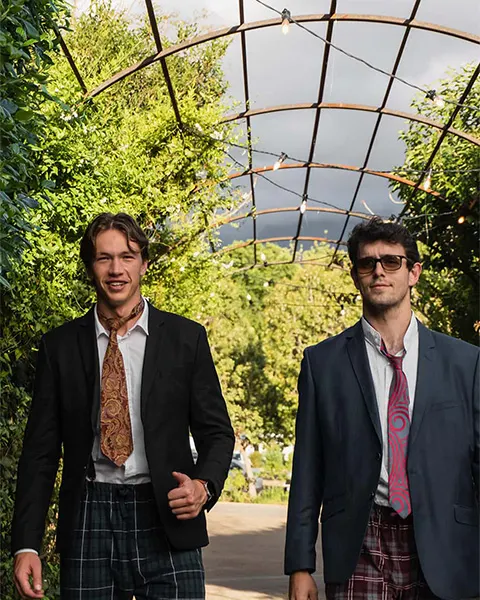 Two men walking to the entrance of Diverso's 20th birthday function