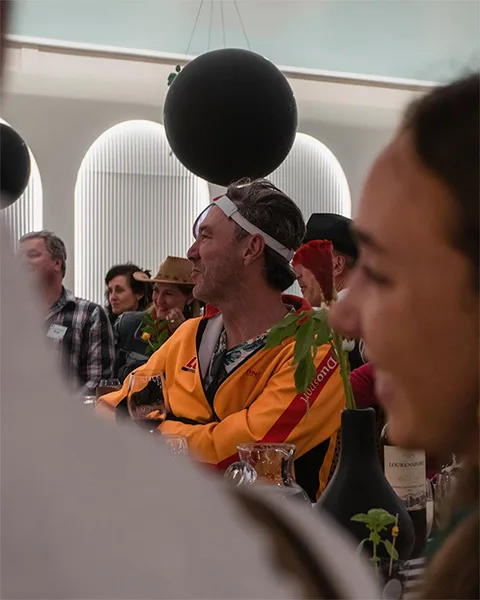 People laughing and enjoying themselves at Diverso's 20th birthday function