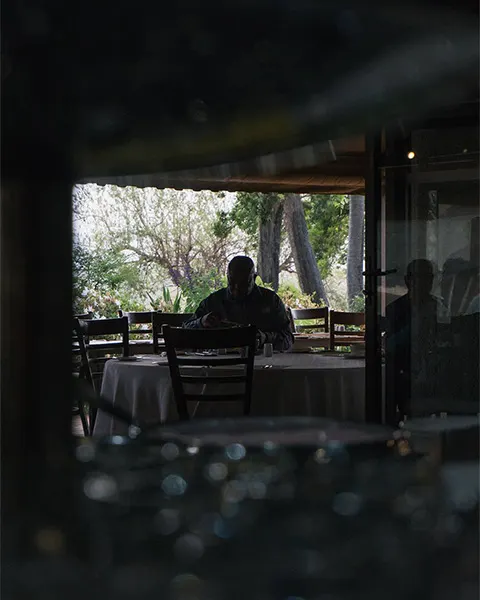 Man eating breakfast alone at the Sabi Sun Resort restaurant